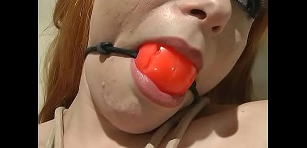  Busty red-haired bitch moans when a lot of clothespins are hung on her pussy, and then massaged with a vibrator